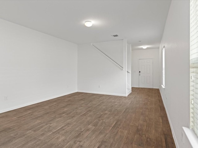 unfurnished room with dark hardwood / wood-style floors