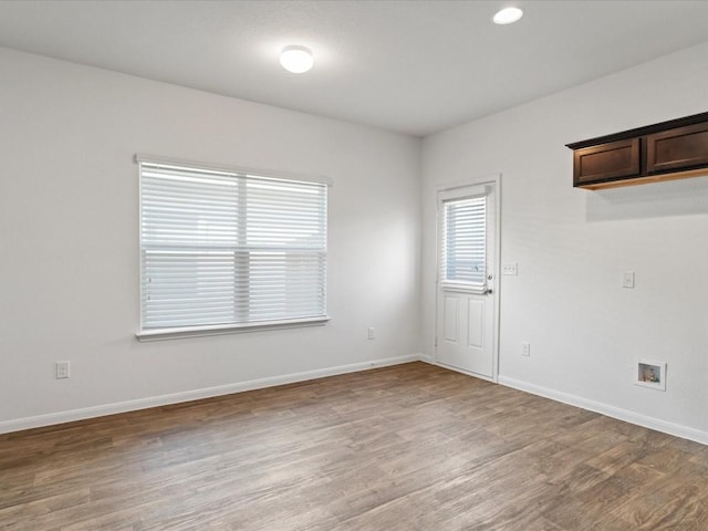 spare room featuring hardwood / wood-style flooring