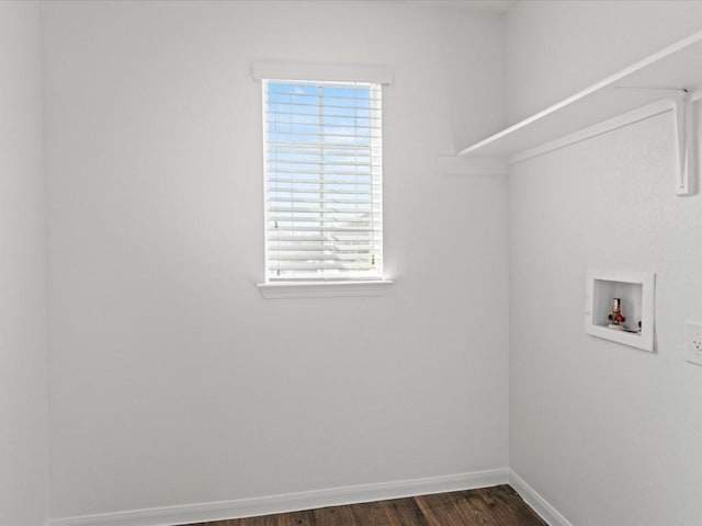 laundry room featuring dark wood-type flooring and washer hookup