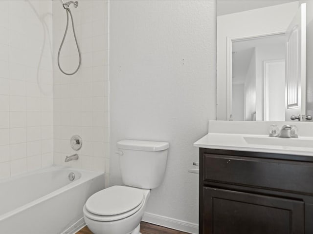 full bathroom with toilet, vanity, tiled shower / bath combo, and hardwood / wood-style flooring