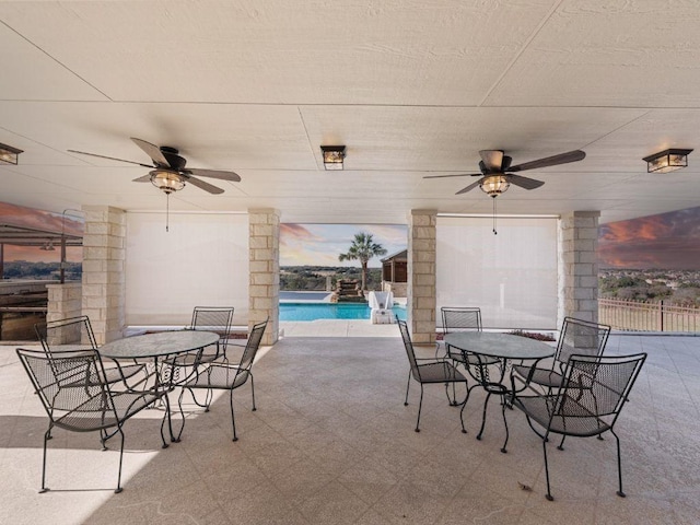 patio terrace at dusk with ceiling fan