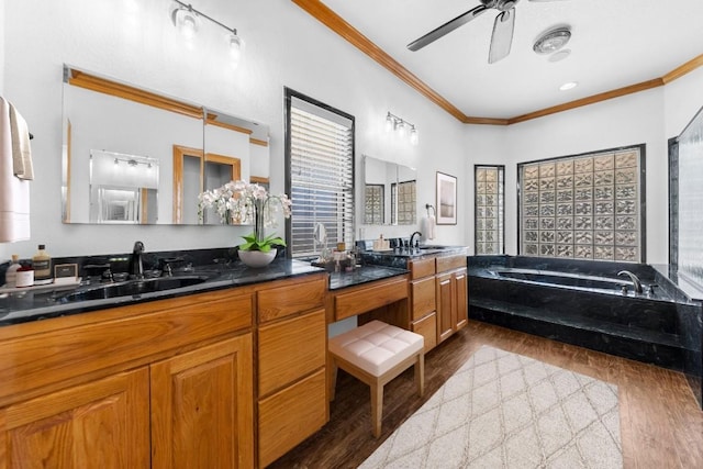 bathroom with vanity, crown molding, ceiling fan, and wood-type flooring