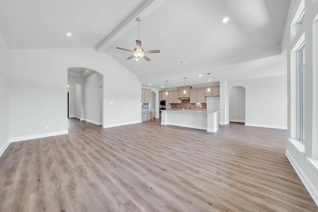 413 Canton Chase, Cibolo, TX 78108 - unfurnished living room featuring arched walkways, ceiling fan, recessed lighting, light wood finished floors, and baseboards