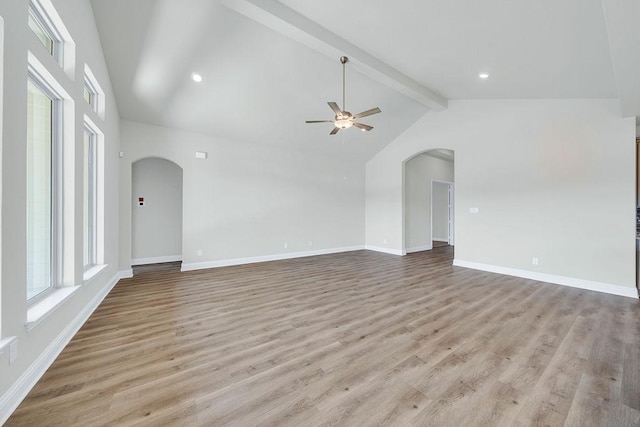 413 Canton Chase, Cibolo, TX 78108 - unfurnished living room with arched walkways, beamed ceiling, healthy amount of natural light, ceiling fan, and high vaulted ceiling