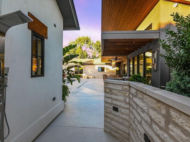 view of patio terrace at dusk