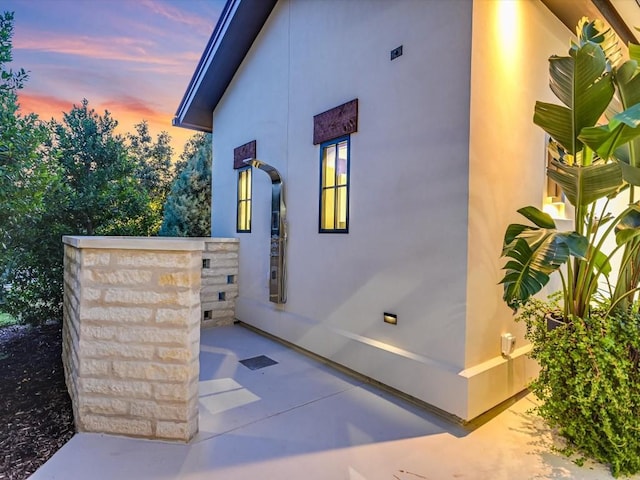 view of property exterior at dusk