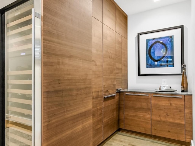 bathroom featuring wood-type flooring and beverage cooler