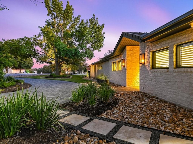 view of property exterior at dusk