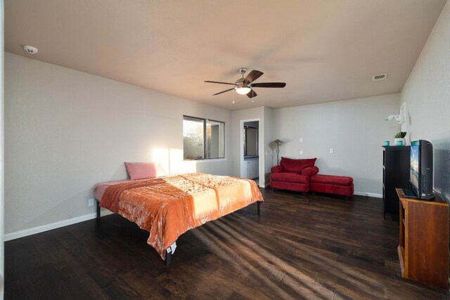 bedroom featuring ceiling fan and dark hardwood / wood-style floors