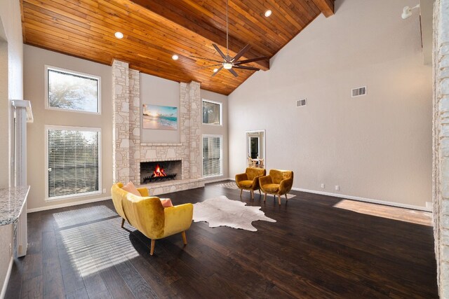 living room featuring wooden ceiling, high vaulted ceiling, ceiling fan, a fireplace, and dark hardwood / wood-style flooring