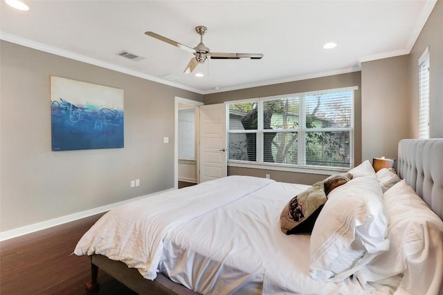 bedroom with ceiling fan, dark hardwood / wood-style flooring, and ornamental molding