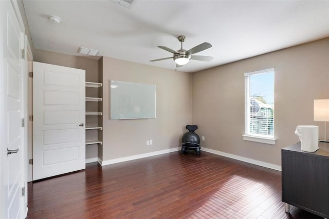 interior space with dark hardwood / wood-style floors and ceiling fan