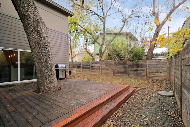 wooden deck featuring grilling area