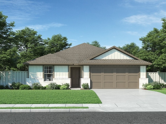 view of front of home featuring a garage and a front lawn