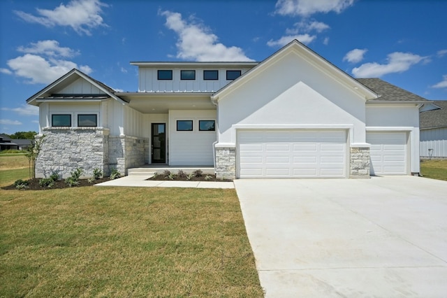 view of front facade featuring a garage and a front lawn