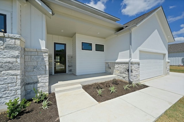 doorway to property featuring a garage