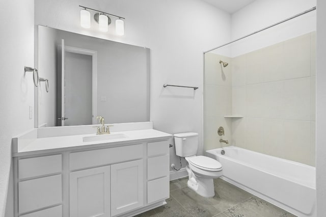 full bathroom with vanity, toilet, and tiled shower / bath