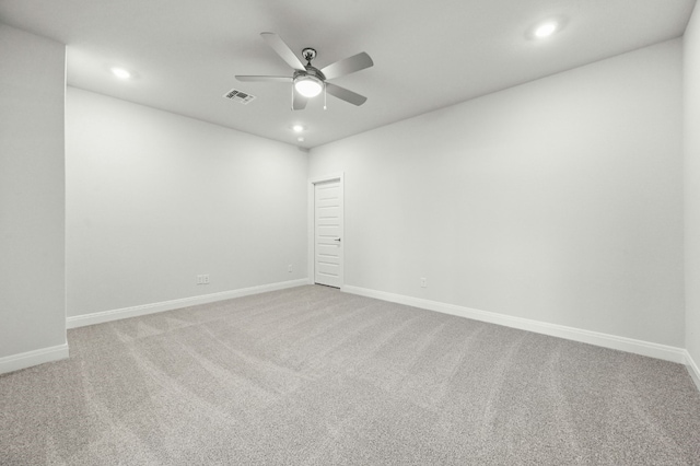 spare room featuring ceiling fan and carpet