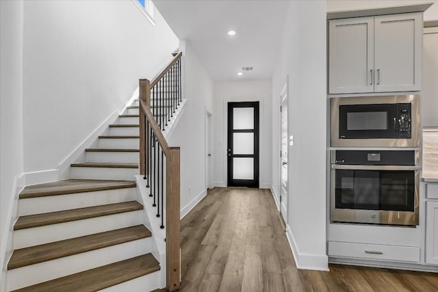 foyer with light hardwood / wood-style flooring