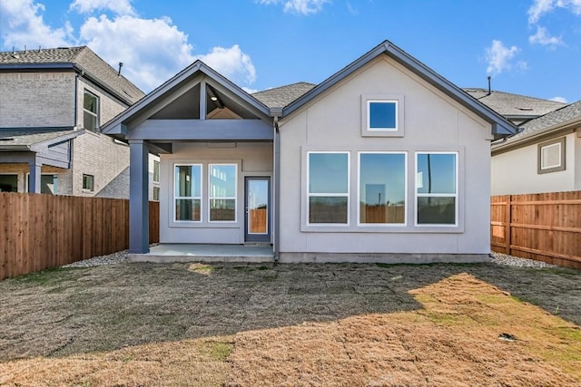 back of property featuring a patio