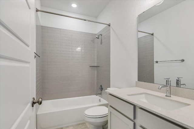 full bathroom with tiled shower / bath combo, vanity, and toilet