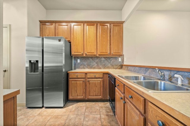 kitchen with decorative backsplash, stainless steel refrigerator with ice dispenser, sink, light tile patterned floors, and dishwasher