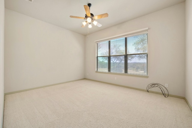 carpeted empty room with ceiling fan