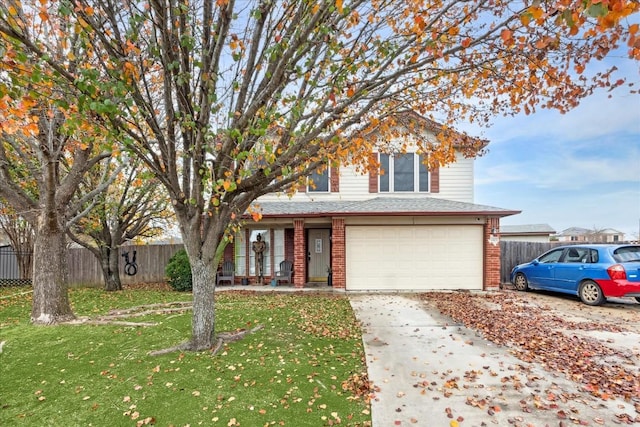 view of front property featuring a porch, a garage, and a front lawn