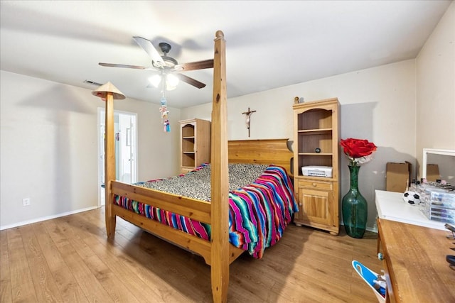 bedroom with ceiling fan and light hardwood / wood-style floors