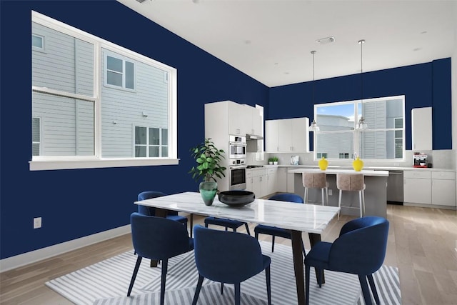 dining room featuring light wood-type flooring