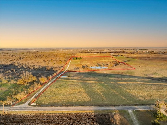 aerial view at dusk with a rural view