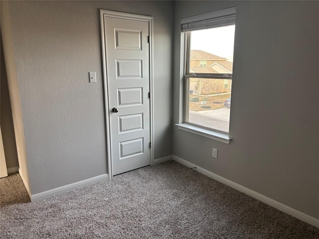 unfurnished room featuring carpet floors