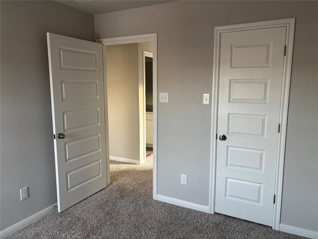 unfurnished bedroom with carpet floors