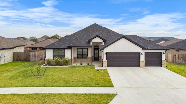 view of front of property with a garage and a front yard