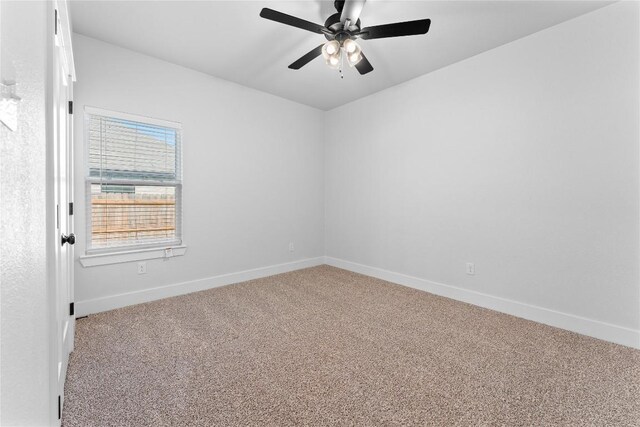 empty room featuring carpet floors and ceiling fan