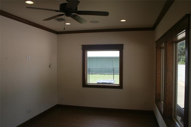 unfurnished room with ornamental molding, dark hardwood / wood-style flooring, and a healthy amount of sunlight