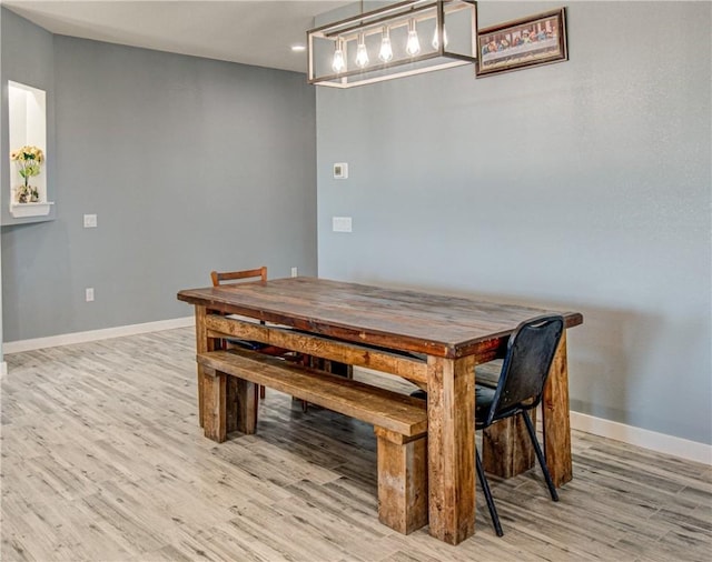 dining room with light hardwood / wood-style floors