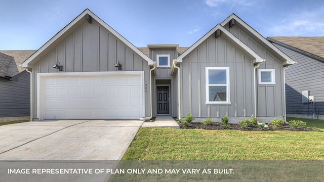 view of front of house with a garage and a front lawn