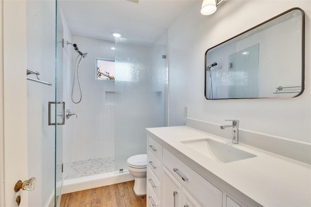 1721 Palma Plz, Austin, TX 78703 - full bath featuring a shower stall, vanity, and wood finished floors