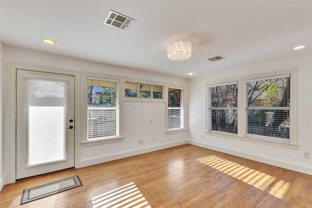 1721 Palma Plz, Austin, TX 78703 - entrance foyer with a chandelier, light wood-type flooring, and recessed lighting