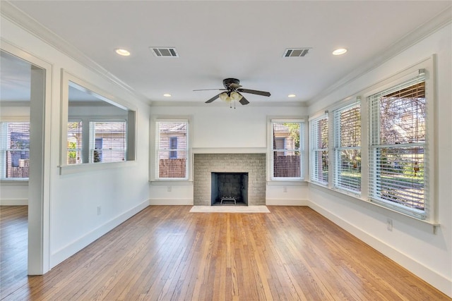 1721 Palma Plz, Austin, TX 78703 - unfurnished living room with ornamental molding, wood-type flooring, ceiling fan, a fireplace, and recessed lighting
