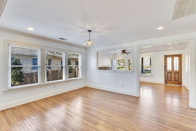 1721 Palma Plz, Austin, TX 78703 - empty room featuring light wood-type flooring, a chandelier, ornamental molding, and recessed lighting