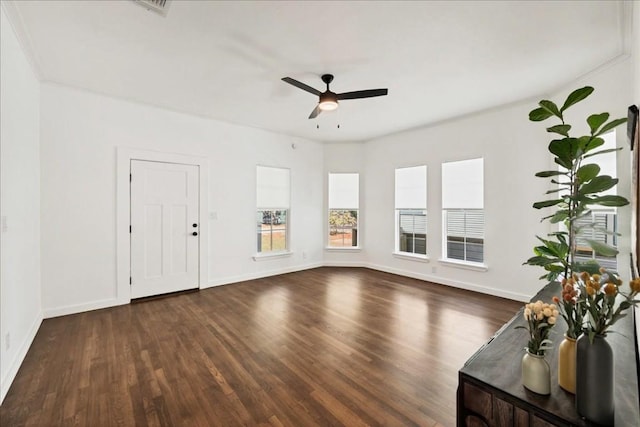 unfurnished living room with ceiling fan and dark hardwood / wood-style floors