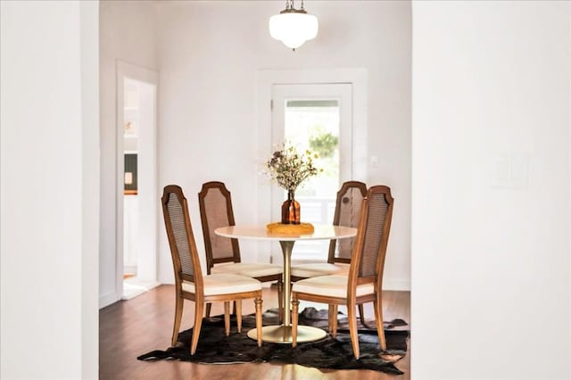 dining area with dark wood-type flooring