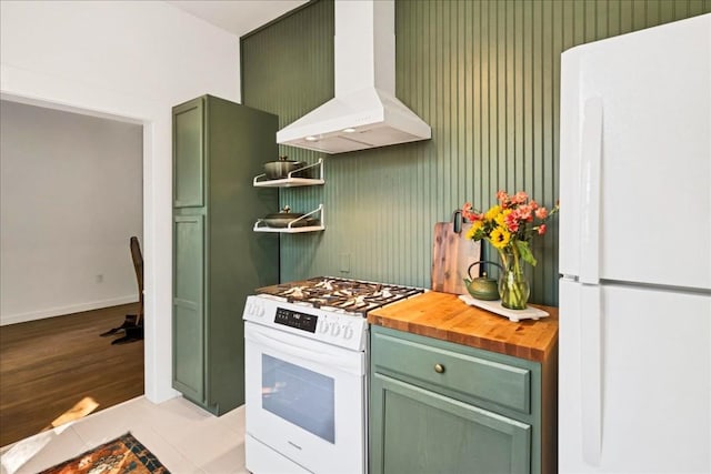 kitchen featuring green cabinetry, wooden counters, white appliances, and ventilation hood