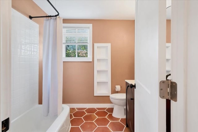 bathroom featuring tile patterned flooring, vanity, and toilet