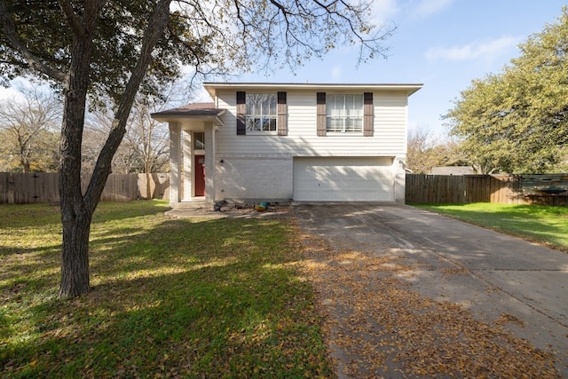 view of front of home with a front lawn and a garage