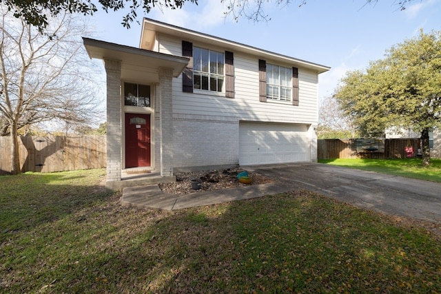 view of front of home with a garage and a front lawn