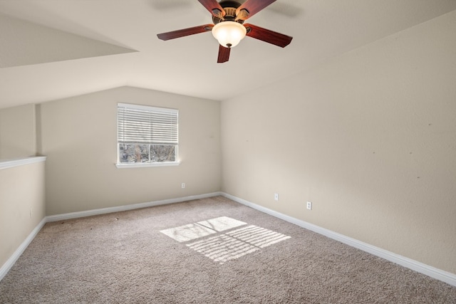 additional living space with light carpet, ceiling fan, and vaulted ceiling