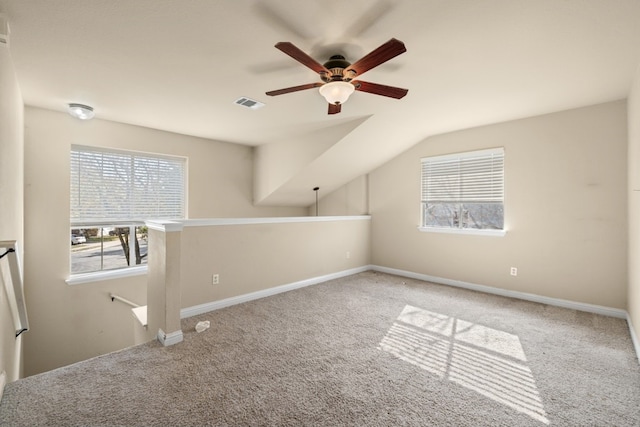 bonus room featuring carpet flooring, vaulted ceiling, and ceiling fan